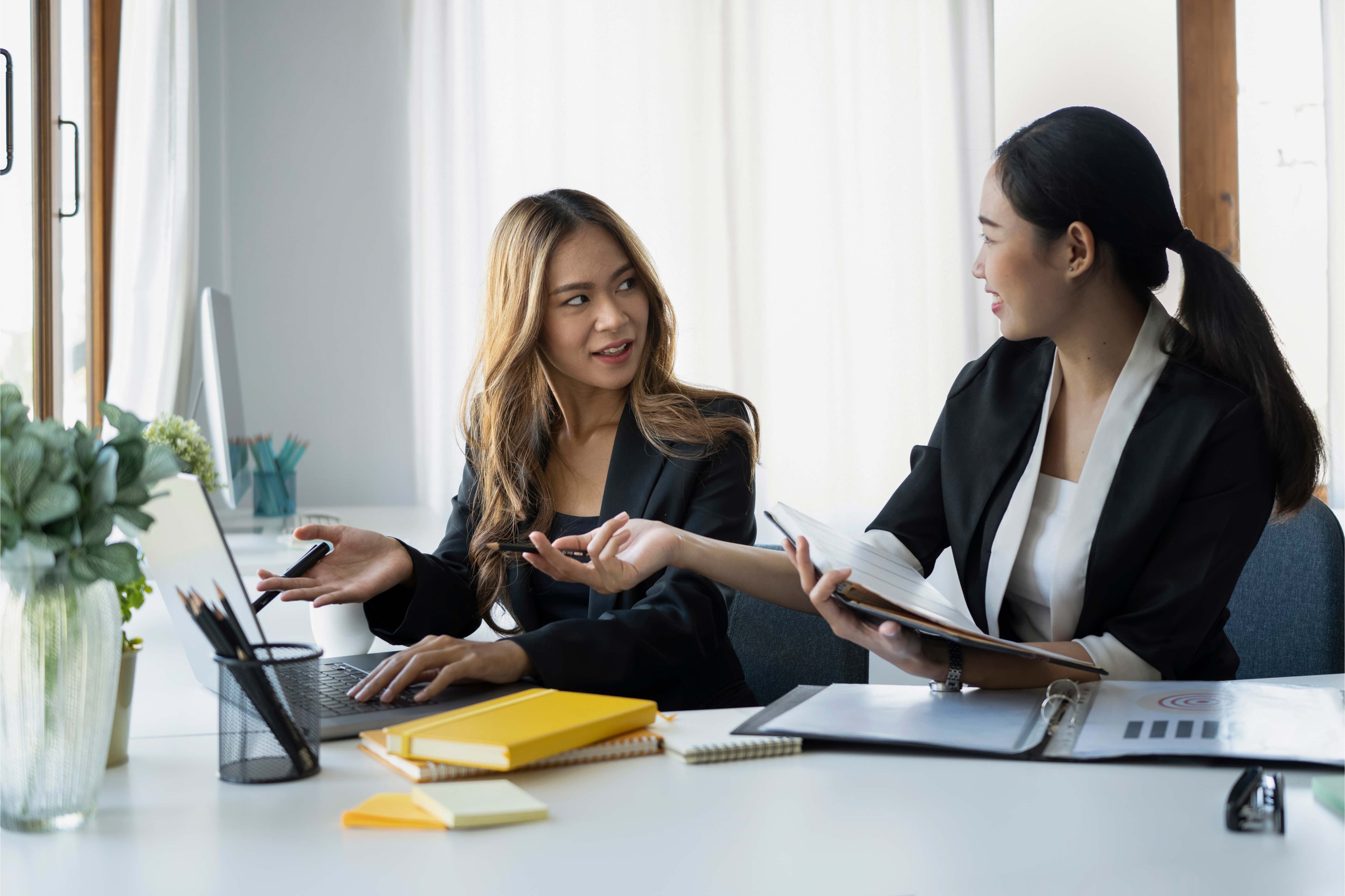 Confident Asian team leader