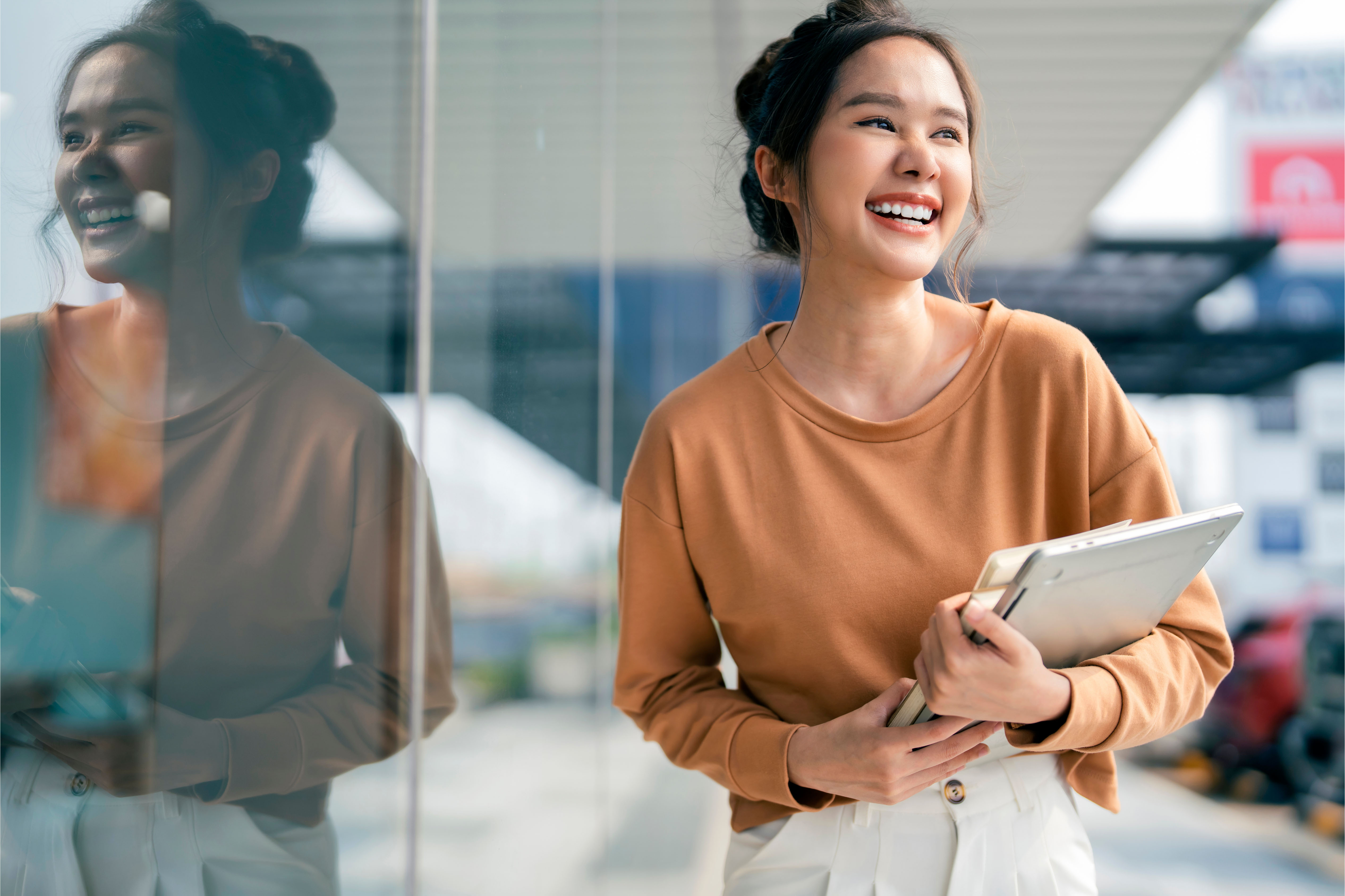 Smiling greeting cheerful asian teen woman