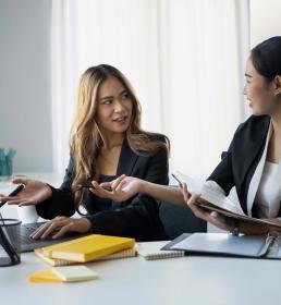 Confident Asian team leader