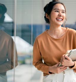 Smiling greeting cheerful asian teen woman
