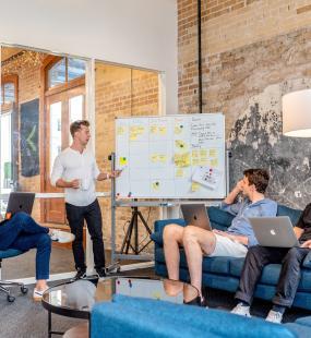 small creative business four men having meeting