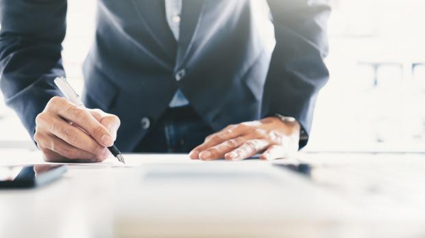 Manager signing a contract liability