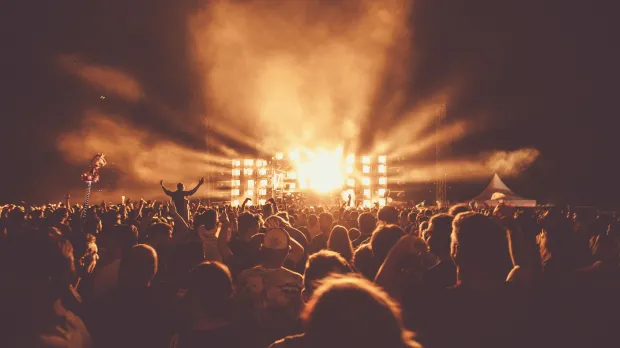 Concert with lighted stage and big attendance