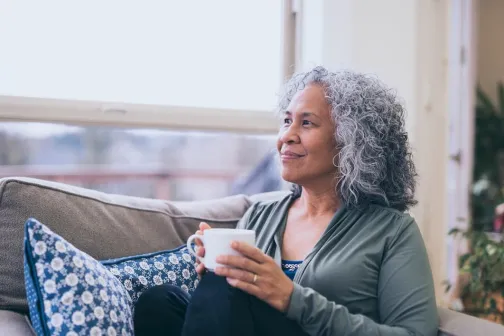 lady drinking coffee on the sofa