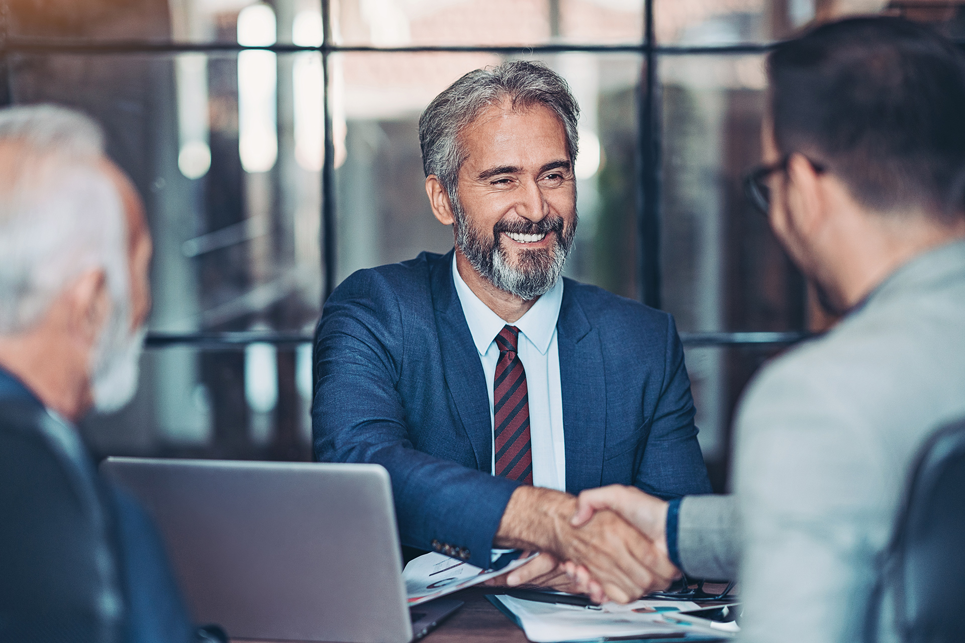 Tow businessmen shaking hands in a meeting