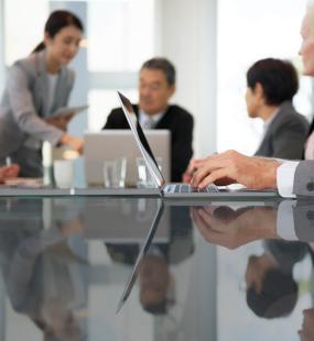 Directors having a discussion in board room