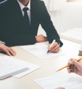 Solicitors signing contracts