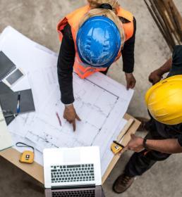 Two construction workers discussing a plan