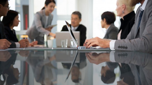 Directors and officers at a board meeting