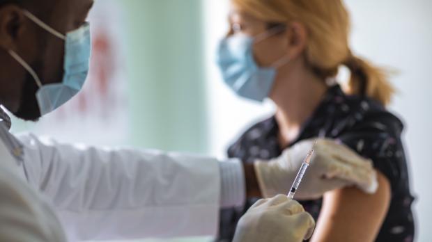 Woman receiving vaccination