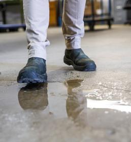 Man about to slip in puddle