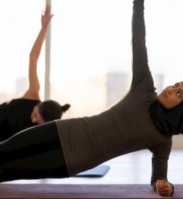 Woman doing yoga on the floor