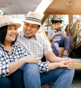 A family and their parked car