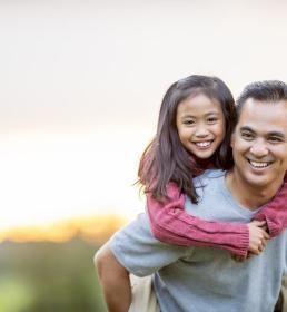 Man with daughter on his back