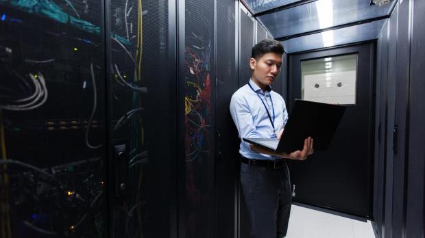 Engineer in a server room Engineer in a server room