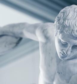 A close-up of the Townley Discobolus: a marble statue of an athlete preparing to throw a discus