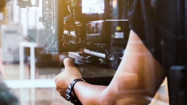 A cameraman operating his camera