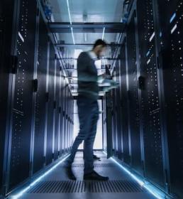 IT engineer examining server racks