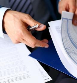 Insurance broker examining paperwork
