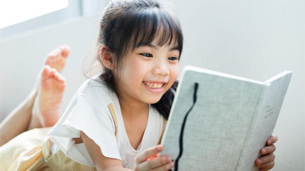 Asian girl reading a book Asian girl reading a book
