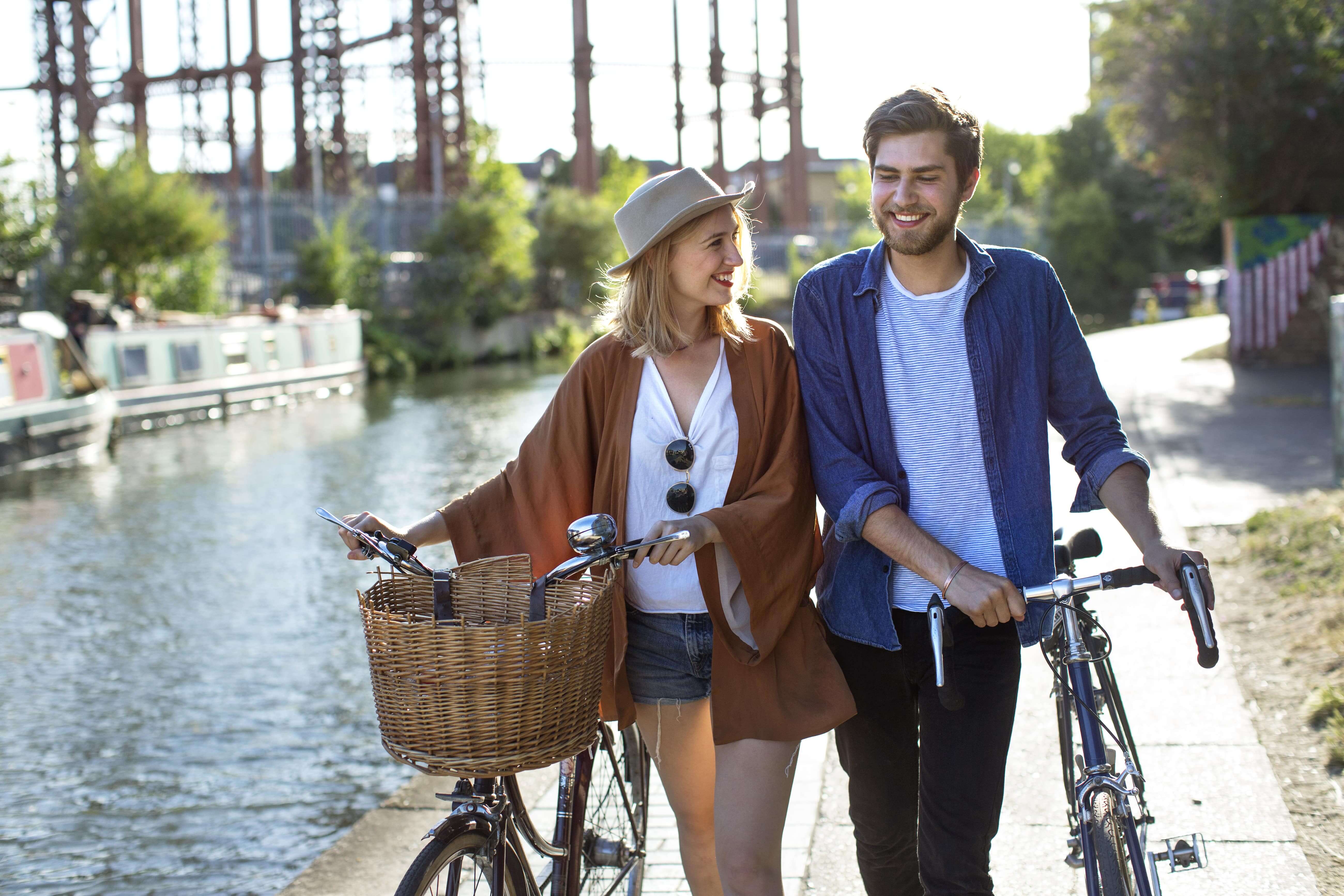 friends walking with bicycles