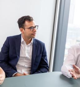 surety team at Howden UK brokers talking in a meeting - meet the team