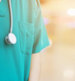 Doctor in green scrubs