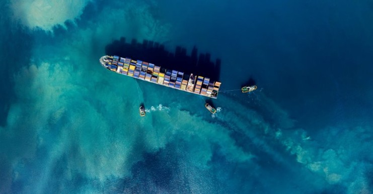 Top down cargo ship in ocean